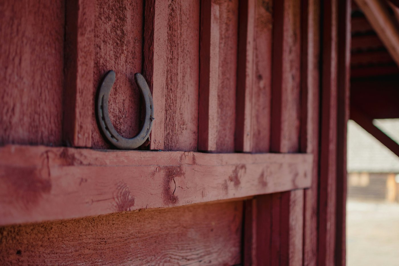 White fence at a horse arena in golden hour light