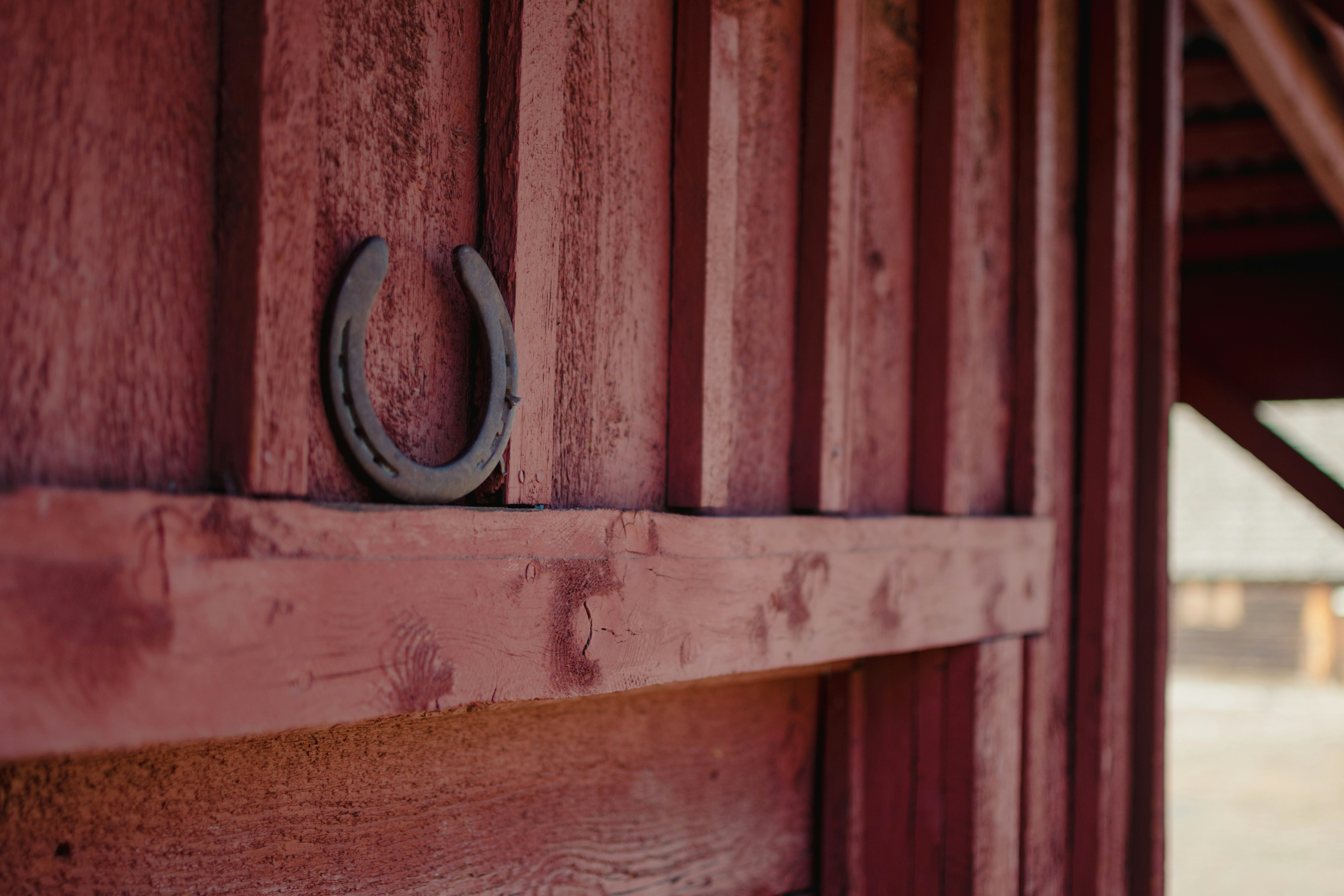 White fence at a horse arena in golden hour light